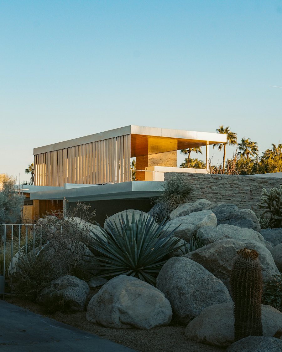 Wood mid-century house among trees